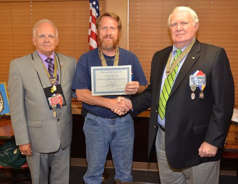 Terry Washam Receives the Exceptioal Metitorius Achievement Award